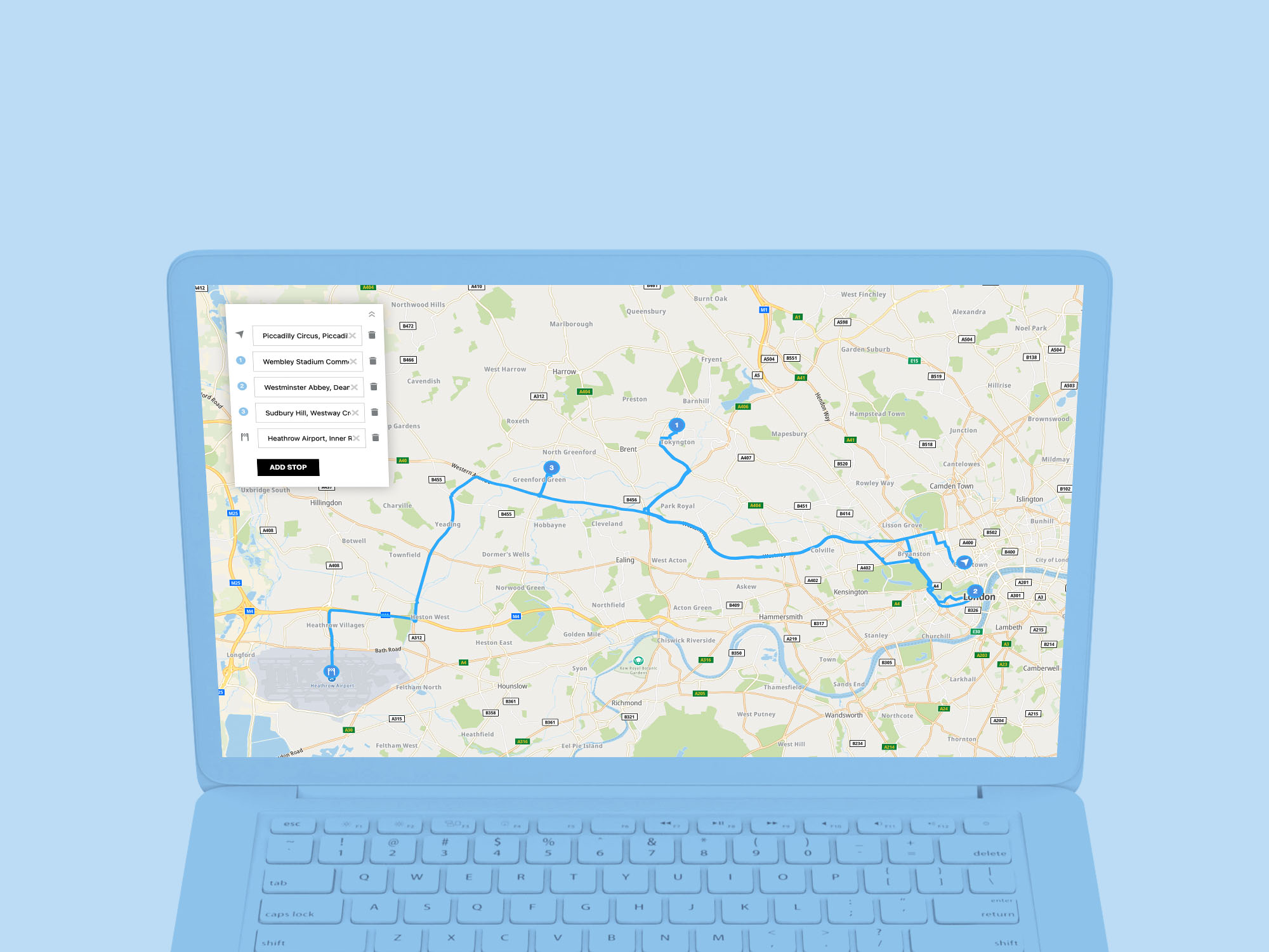 Laptop screen displaying TomTom map with Waypoint routing