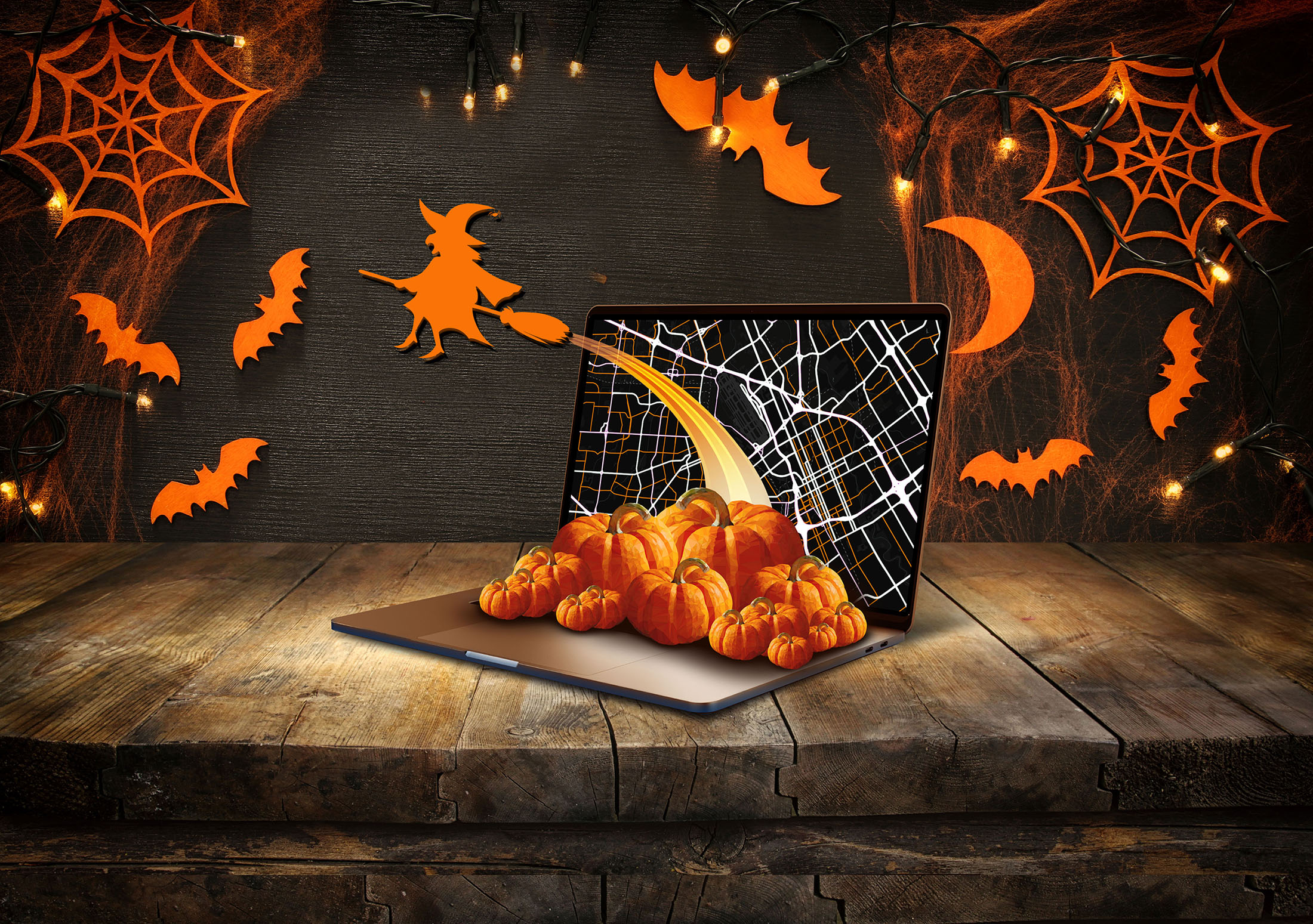 Halloween image featuring bats, witches, and pumpkins. 