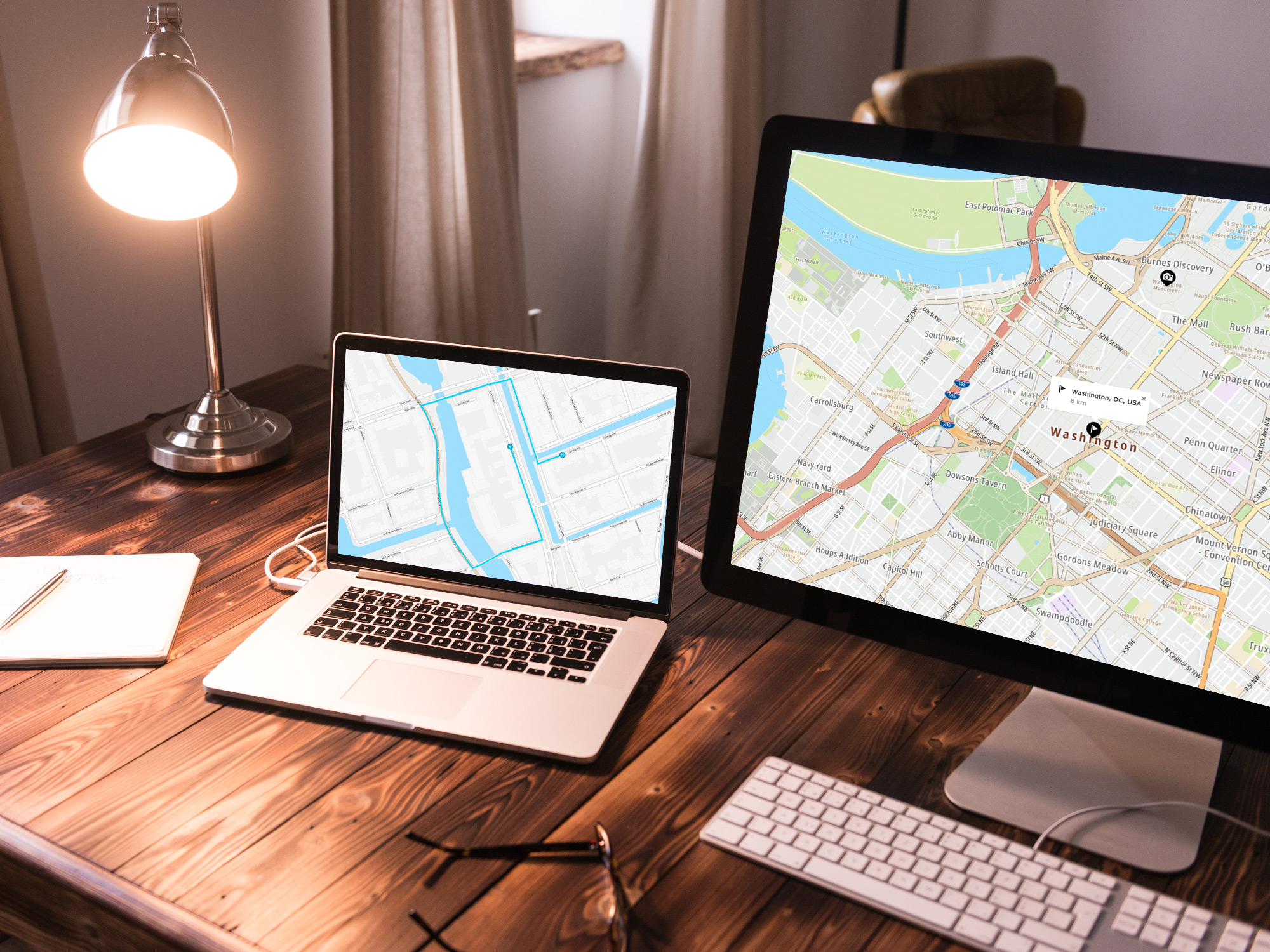 Laptop and monitor displaying TomTom Maps SDK for Web V6