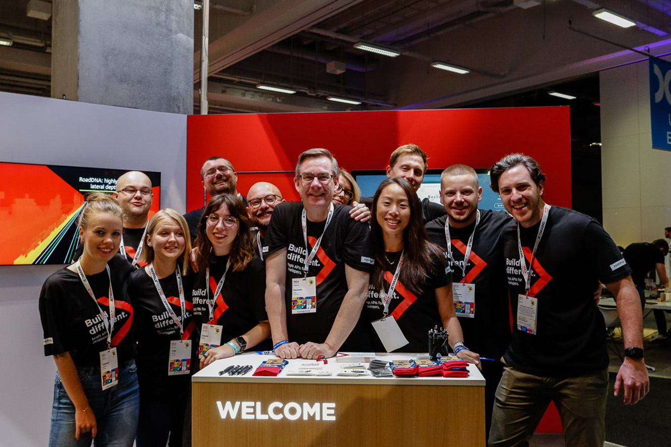 TomTom Developer team smiling for a group photo. 